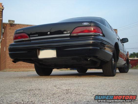 Rear view of a black 1992 Ford Crown Victoria parked on pavement