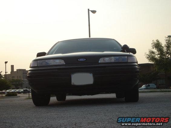 Black 1992 Ford Crown Victoria front view, license plate obscured, parked on asphalt