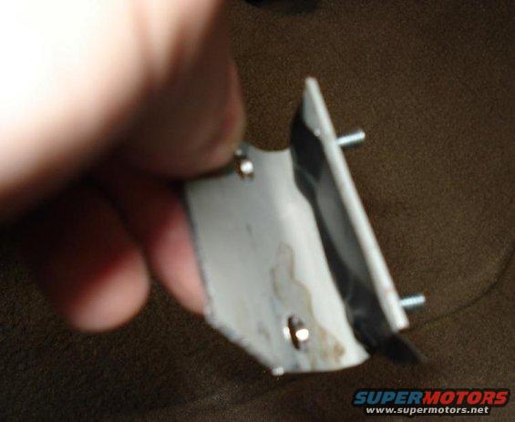 Before mounting the bracket I used tape to hold screws in place while I put the nuts of