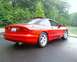 1993 Ford Probe - Rear 3/4 view of a red 1993 Ford Probe GT with a sunroof.