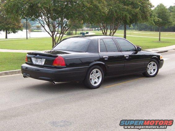 Black 2001 Ford Crown Victoria sedan, rear 3/4 view