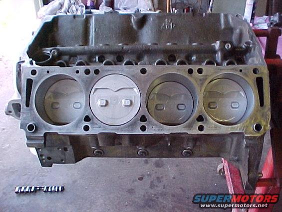 installed-pistons-017f.jpg Original GT-E pistons C3AE Low Riser type. Engine is a '68 Side Oiler hydraulic lifter block.