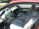 1996 Lincoln Mark VIII - The interior of a 1996 Lincoln Mark VIII features light gray leather seats and a clean dashboard.