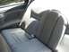 1996 Lincoln Mark VIII - The interior of a 1996 Lincoln Mark VIII features plush leather rear seating with a prominent Lincoln emblem.