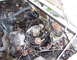 1971 Porsche 914 - A cluttered engine bay shows a carburetor and various hoses and wires.