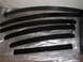 1991 Ford Bronco - Several black leaf springs are arranged on a clear plastic sheet on the floor.