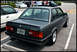 1989 BMW 3 Series - Rear view of a dark gray 1989 BMW 325i sedan with a spoiler and aftermarket wheels.