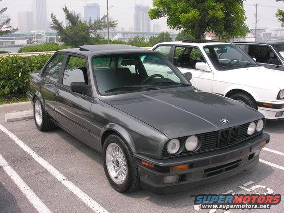 Dark gray 1989 BMW 3 Series coupe parked next to a white BMW