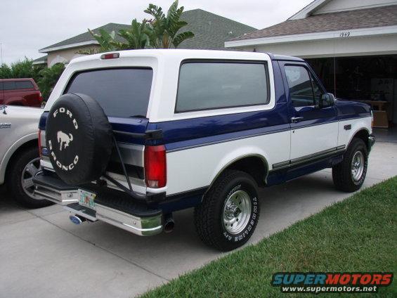 Blue and white Ford Bronco rear view with spare tire. 1996 Ford Bronco