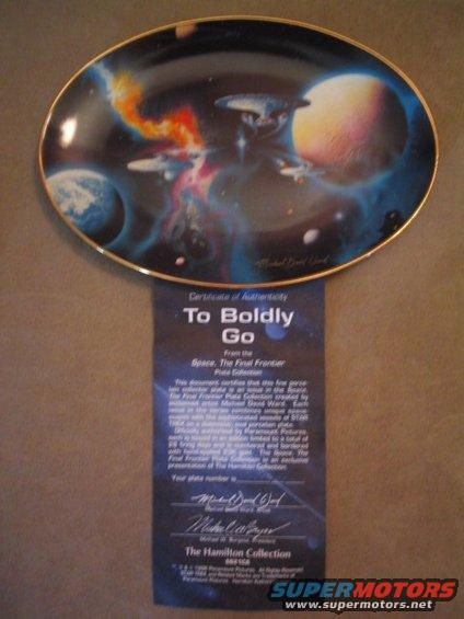 Decorative plate depicting space scene, with a certificate of authenticity for 'To Boldly Go' plate collection
