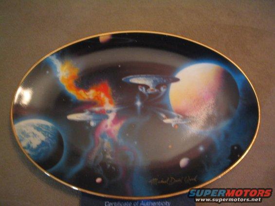 Decorative plate starships in space with planets and nebulae