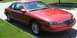 1996 Lincoln Mark VIII - This 1996 Lincoln Mark VIII is a red coupe seen parked on a residential street.