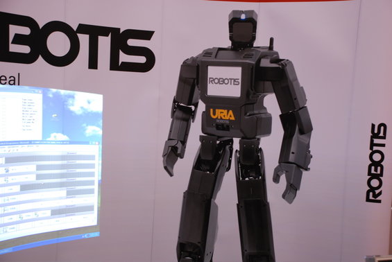 Black humanoid robot with "ROBOTIS" and "URIA" logos