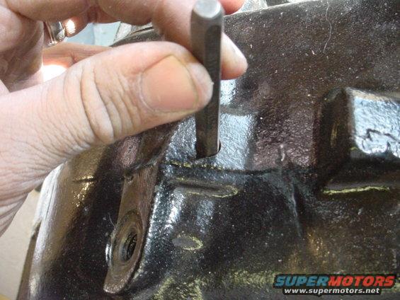 Knock out freeze plug on the rear shift rail