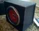 1901 Honda Odyssey - A black subwoofer with a red cone is shown on a carpeted surface.