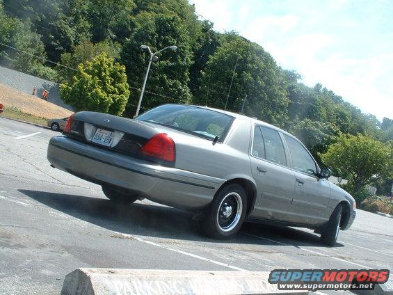 Silver 2000 Ford Crown Victoria, rear-left view, parked on asphalt