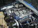 1997 Ford Ranger - Close-up view of a modified diesel engine, likely a Cummins, with a large turbocharger and custom fuel lines.