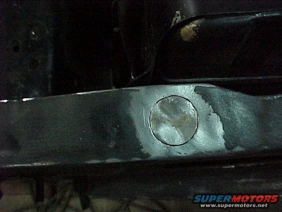 Filling a 3/4" hole in the radiator core support - the previous owner had an alarm system installed.........