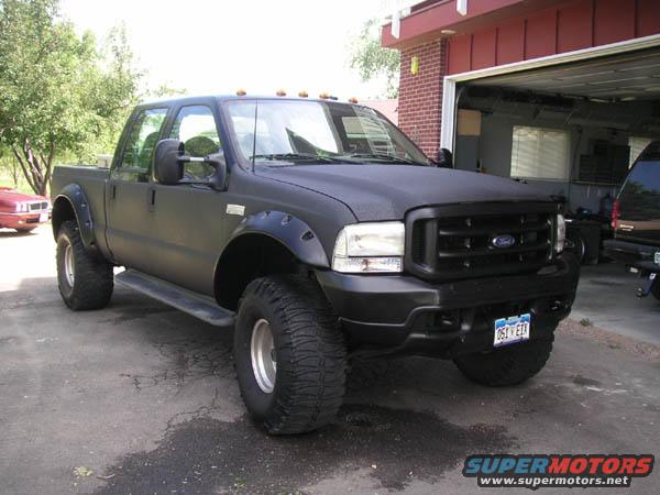 blackedout.jpg a guys truck on PBB.  Love the line-x and gloss black!