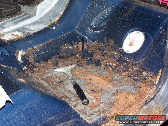 scrapping.jpg Tar / Sound deadner reomoval.  Use a hammer and scrapper and a hammer