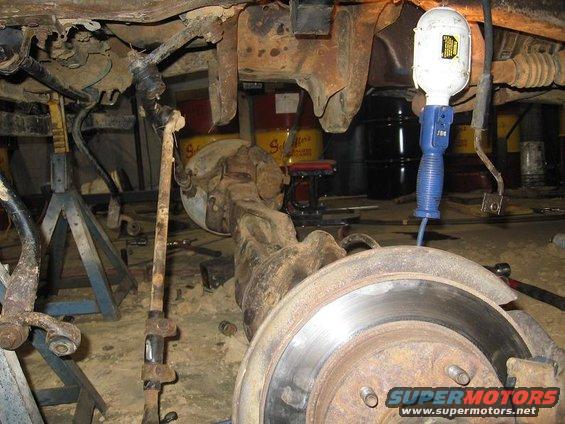 sway bar disconnected
axle laying on the floor 
drive shaft hanging out
old i-beam brackets removed, not as bad as i thought it would be