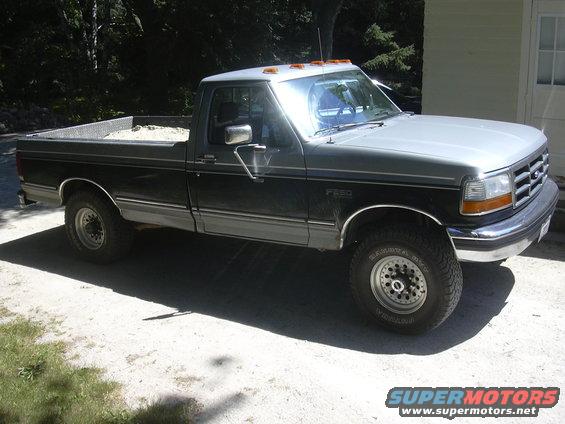 Two-tone gray and black 1992 Ford F-250 pickup truck with a silver roof, parked outdoors