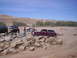 1989 Ford Bronco - Several trucks, including a 1989 Ford Bronco, are off-roading over a rocky obstacle course.