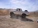 1989 Ford Bronco - This lifted 1978 Ford Bronco navigates a dusty, off-road terrain.