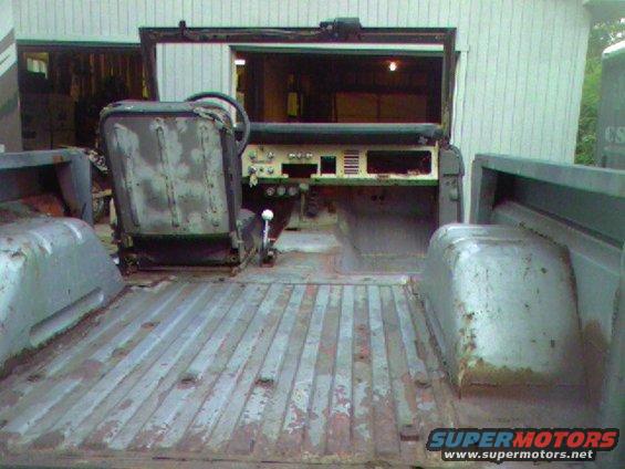 1974 Ford Bronco interior, showing front seats and bed