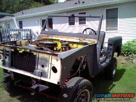 1974 Ford Bronco front end with engine exposed, partially disassembled