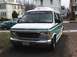 1992 Ford E150 - This 1992 Ford E150 van features a distinctive white and green paint scheme and a "UNIVERSAL" banner across the top of the windshield.