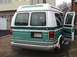 1992 Ford E150 - This 1992 Ford E150 van features a teal and white exterior with the rear doors ajar.