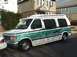 1992 Ford E150 - This 1992 Ford E150 conversion van features a distinctive green stripe and a raised roof.