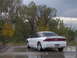 1996 Ford Probe - White 1996 Ford Probe GT parked outdoors on a cloudy day, showing its rear profile.