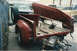 1967 Ford F-100 - This 1967 Ford F-100 shows its disassembled bed and spare tire, hinting at its current state in a wrecking yard.