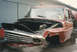 1967 Ford F-100 - This damaged red pickup truck is missing its engine and has significant front-end damage.