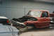 1967 Ford F-100 - Front view of a damaged 1967 Ford F-100 truck cab in a wrecking yard.