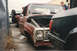 1967 Ford F-100 - A red 1967 Ford F-100 pickup truck is parked outside with its hood up, next to another vehicle.