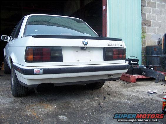 1989 BMW 3 Series sedan, rear view, showing 325is badge and black spoiler