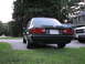 1989 BMW 3 Series - This 1989 BMW 3 Series sedan is parked in a driveway next to another vehicle.