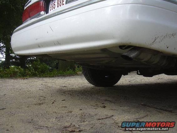 White 1997 Ford Crown Victoria rear bumper and exhaust pipe