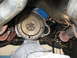 1973 Ford Ranchero - Close-up view of a vehicle's transmission and flywheel assembly, showing mechanical components.