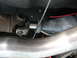 1973 Ford Ranchero - Close-up view of a vehicle's driveshaft and transmission components, showing a U-joint connection.