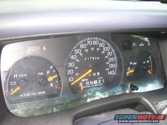 Dashboard gauges with odometer reading 217938, fuel gauge, and temperature gauge