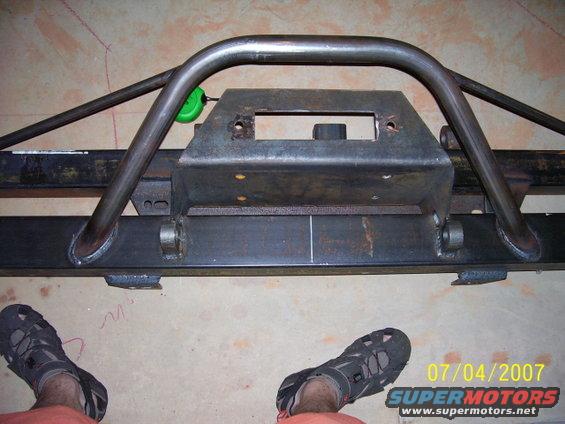 Custom steel roll cage and bumper assembly with a winch mount, viewed from the front