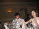 1988 Ford Bronco - Guests at a formal event are seated at a table with drinks and a large decorative martini glass.