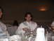 1988 Ford Bronco - A man in formal attire sits at a table during a wedding reception, looking surprised.