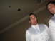 1988 Ford Bronco - Two men in formal attire are captured in this indoor photograph.