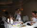 1988 Ford Bronco - A wedding reception is underway with guests seated at tables and a woman giving a speech.