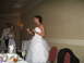 1988 Ford Bronco - Bride speaks at her wedding reception, holding a microphone and a glass of champagne.